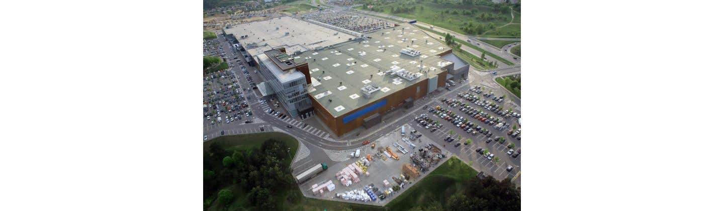 Overhead shot of a large parking lot with numerous cars parked