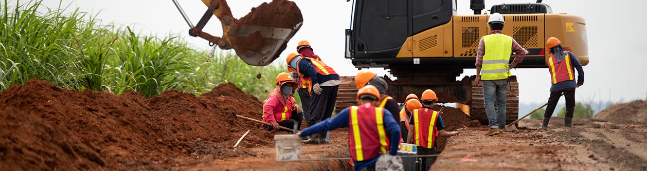 Workers on a trenching jobsite