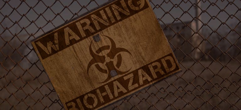 Fence with biohazard warning sign